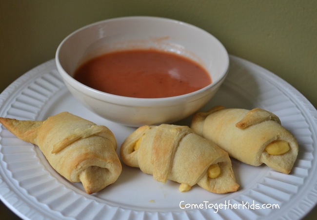 12. Grilled Cheese Bites: sliced cheese +  crescent rolls. Cut the cheese slices in half and roll them into the crescent dough. Bake for 13 minutes.