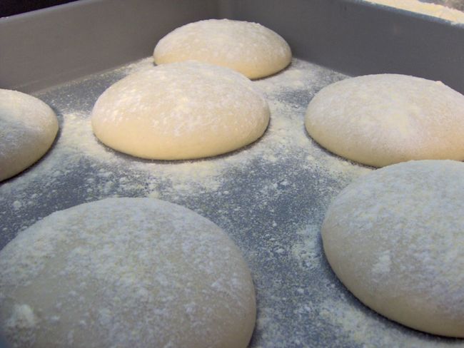 23. Pizza Dough: self rising flour + Greek yogurt. Mix together and form a ball, then knead the dough for 5-8 minutes and flatten.